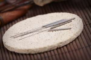 Acupuncture needles on the stone mat